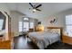 Vaulted ceiling in main bedroom featuring wood floors, ceiling fan and lots of natural light at 8021 Hilliard Ave, Las Vegas, NV 89128