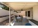Covered patio featuring an outdoor dining area with seating, great for enjoying outdoor meals at 8021 Hilliard Ave, Las Vegas, NV 89128