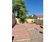 Backyard featuring brick patio and desert landscaping at 8900 Big Bear Pines Ave, Las Vegas, NV 89143