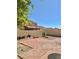 Paver patio and gravel in this home's backyard provide a relaxing outdoor space at 8900 Big Bear Pines Ave, Las Vegas, NV 89143