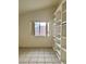 Bedroom featuring a window and a built-in shelving unit at 8900 Big Bear Pines Ave, Las Vegas, NV 89143
