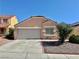 Charming single-story home featuring a two-car garage, desert landscaping, and a classic tile roof at 8900 Big Bear Pines Ave, Las Vegas, NV 89143
