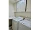Laundry room including a washer, dryer, and built in cabinets at 8900 Big Bear Pines Ave, Las Vegas, NV 89143