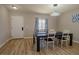 Modern dining room featuring a dark wood table and chairs, with ample lighting at 920 Biltmore Dr, Las Vegas, NV 89101