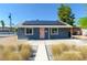 Charming single-story home with solar panels and a light pink front door at 920 Biltmore Dr, Las Vegas, NV 89101