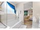 Bathroom features a separate tub and a view of the bedroom at 9288 Valley Betica Ave, Las Vegas, NV 89148