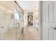 Large bright bathroom boasting a glass enclosed shower, vanity, and view into the primary bedroom at 9288 Valley Betica Ave, Las Vegas, NV 89148