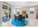 Dining room featuring a chandelier, modern furniture, and sliding door access to the patio at 9288 Valley Betica Ave, Las Vegas, NV 89148