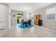 Inviting dining area features elegant chandelier and sliding glass doors to the patio at 9288 Valley Betica Ave, Las Vegas, NV 89148