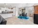 Open-concept space with kitchen and dining area with a blue rug and modern fixtures at 9288 Valley Betica Ave, Las Vegas, NV 89148