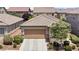 Charming single-story home featuring a two-car garage, desert landscaping and a tile roof at 9288 Valley Betica Ave, Las Vegas, NV 89148