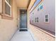 Inviting blue front door with decorative glass and neutral-colored exterior, enhancing curb appeal and modern style at 9288 Valley Betica Ave, Las Vegas, NV 89148