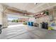 Two car garage with overhead storage and view of the well maintained community at 9288 Valley Betica Ave, Las Vegas, NV 89148