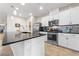 Bright kitchen with stainless steel appliances, a central island, and sleek countertops, perfect for modern living at 9288 Valley Betica Ave, Las Vegas, NV 89148