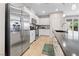 Modern kitchen features stainless steel appliances, sleek countertops, and ample cabinet space at 9288 Valley Betica Ave, Las Vegas, NV 89148