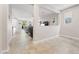 Open-concept living room with stylish half wall, tile flooring, and abundant natural light creating a cozy, modern atmosphere at 9288 Valley Betica Ave, Las Vegas, NV 89148