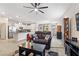 Spacious living area flows into the kitchen, featuring modern decor, ample lighting, and a comfortable ambiance at 9288 Valley Betica Ave, Las Vegas, NV 89148