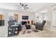 Inviting living room featuring plush seating, a ceiling fan, and an open layout, perfect for relaxation and entertaining at 9288 Valley Betica Ave, Las Vegas, NV 89148