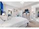 Bright and airy bedroom showcasing walk-in closets and en-suite bathroom at 9288 Valley Betica Ave, Las Vegas, NV 89148