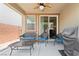 Covered patio area featuring comfortable outdoor furniture, a ceiling fan and BBQ grill at 9288 Valley Betica Ave, Las Vegas, NV 89148