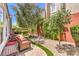 Secluded backyard featuring patio seating and charming landscaping at 979 Coatbridge St, Las Vegas, NV 89145