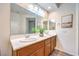 Well-lit bathroom featuring dual sinks, a large mirror, and modern fixtures at 979 Coatbridge St, Las Vegas, NV 89145