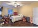Bedroom featuring a neutral color palette, wood-look floors, and a window at 979 Coatbridge St, Las Vegas, NV 89145