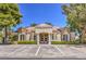 Community clubhouse with covered entryway and mature landscaping at 979 Coatbridge St, Las Vegas, NV 89145