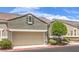 Close-up of a two-car garage door with the home's exterior in the background on a bright, sunny day at 979 Coatbridge St, Las Vegas, NV 89145