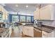 Well-lit kitchen featuring stainless steel appliances, granite counters and an open view to the living room at 979 Coatbridge St, Las Vegas, NV 89145