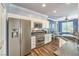 Well-equipped kitchen features stainless steel appliances, wooden floors, and a breakfast nook at 979 Coatbridge St, Las Vegas, NV 89145