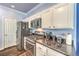 Charming kitchen with stainless steel appliances and granite countertops, lots of storage at 979 Coatbridge St, Las Vegas, NV 89145