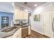 Kitchen featuring stainless steel appliances and granite counters, with adjacent breakfast bar at 979 Coatbridge St, Las Vegas, NV 89145