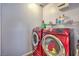 Laundry room with red front load washer and dryer at 979 Coatbridge St, Las Vegas, NV 89145