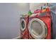 Laundry room showcasing a side-by-side washer and dryer with plenty of storage space at 979 Coatbridge St, Las Vegas, NV 89145