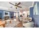 Living room with fireplace, hardwood floors and views of the kitchen at 979 Coatbridge St, Las Vegas, NV 89145