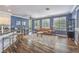 Open-concept living room and kitchen with hardwood floors and neutral decor at 979 Coatbridge St, Las Vegas, NV 89145