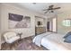 Relaxing main bedroom boasts tiled floors, comfortable furniture, and tasteful wall decor at 979 Coatbridge St, Las Vegas, NV 89145