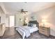 Comfortable main bedroom featuring a ceiling fan, tiled floors, and and nightstands at 979 Coatbridge St, Las Vegas, NV 89145