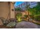 Private patio space with lush landscaping and custom water feature at 979 Coatbridge St, Las Vegas, NV 89145