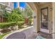 Charming covered patio with lush green landscaping providing privacy at 979 Coatbridge St, Las Vegas, NV 89145