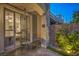 Private outdoor patio with seating, landscaping, and sliding glass door leading indoors at 979 Coatbridge St, Las Vegas, NV 89145