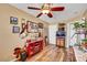 Bedroom with wood-look floors, ceiling fan, and decorative furnishings; a cozy and inviting space at 1068 African Eagle Ave, Henderson, NV 89015