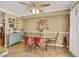 Eat-in kitchen area features a dining table with seating, tile flooring, and a ceiling fan at 1068 African Eagle Ave, Henderson, NV 89015