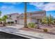 Beautiful front of the home with desert landscaping and a two-car garage, with a blue sky at 1068 African Eagle Ave, Henderson, NV 89015
