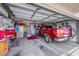 Spacious garage featuring ample storage space, a parked pickup truck, and an organized interior at 1068 African Eagle Ave, Henderson, NV 89015