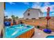 Inviting backyard hot tub with clear blue water, providing a tranquil oasis for relaxation and leisure at 1068 African Eagle Ave, Henderson, NV 89015