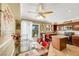 Eat-in kitchen area features tile flooring, granite counters, an island, and backyard access at 1068 African Eagle Ave, Henderson, NV 89015