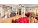 Cozy living room featuring tile flooring, a ceiling fan, and a staircase, and cozy furniture at 1068 African Eagle Ave, Henderson, NV 89015