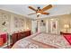Spacious primary bedroom features wood floors, a ceiling fan, and vintage decor at 1068 African Eagle Ave, Henderson, NV 89015